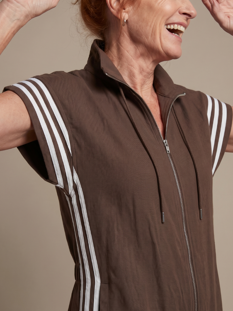 Trendy striped zip-up jumpsuit for women, a sleek and modern one-piece design.