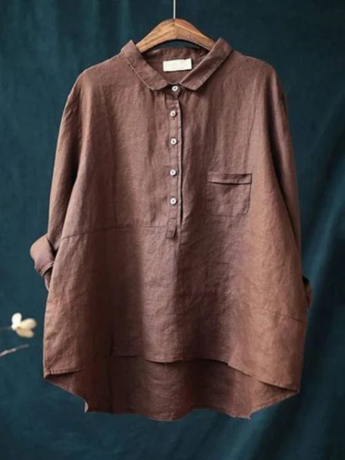 Versatile women's blouse with an asymmetrical hem and classic button-up front.