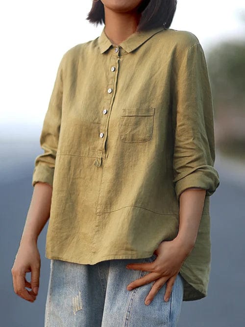 Trendy women's long sleeve blouse with a distinctive asymmetrical hem and button-up front.