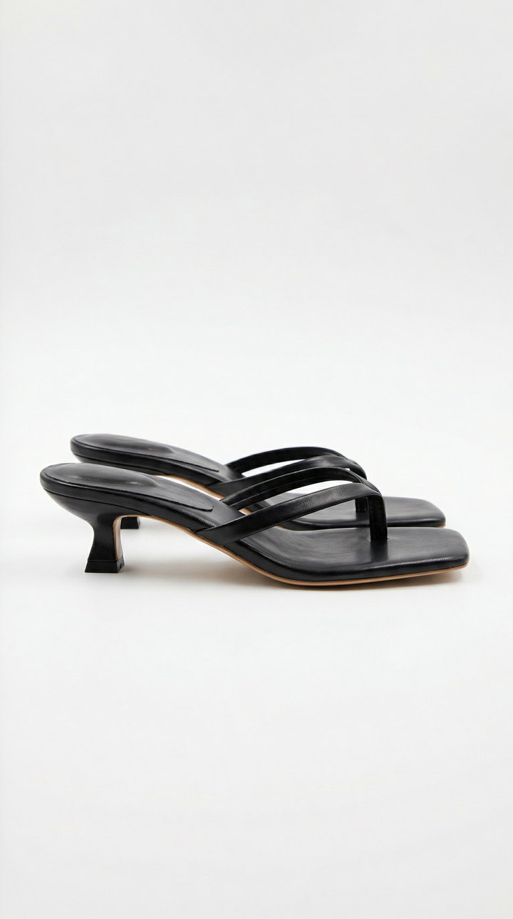Women's stylish black thong kitten heel sandals for elegant summer occasions.