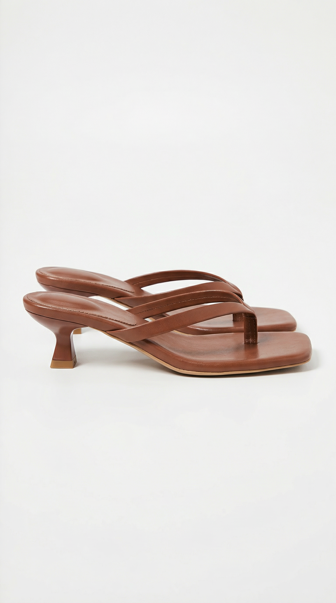 Stylish women's summer sandals featuring a comfortable thong and kitten heel.