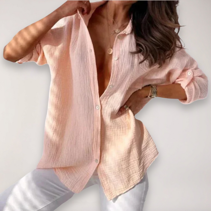 Women's stylish button-down blouse with roll-up sleeves for comfortable casual or office wear.