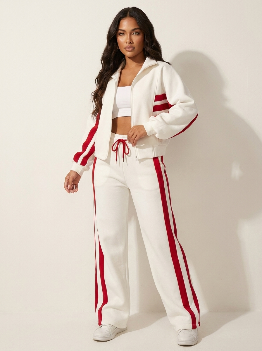 Comfortable women's athletic style tracksuit, zip-up jacket & wide-leg pants, contrast stripe loungewear.