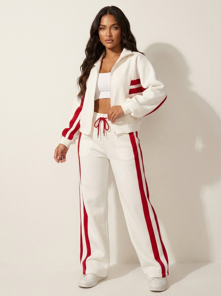 Comfortable women's athletic style tracksuit, zip-up jacket & wide-leg pants, contrast stripe loungewear.