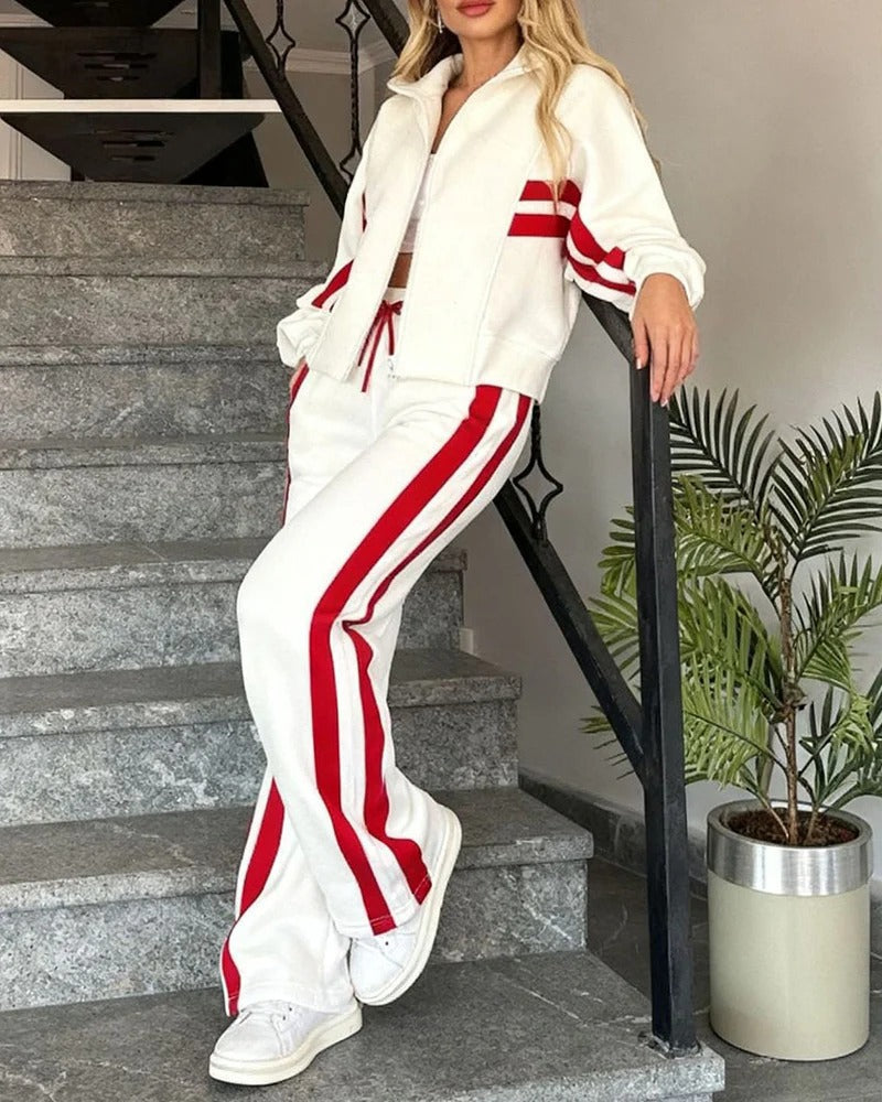 Casual women's tracksuit with a zip-up top & wide-leg pants, featuring chic contrast stripes. Perfect loungewear.