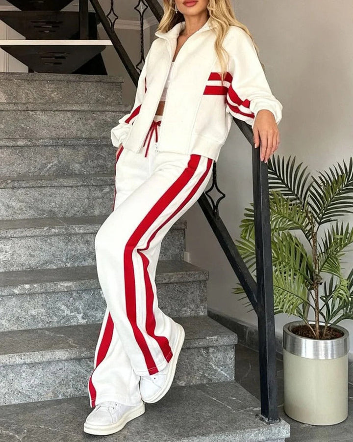 Casual women's tracksuit with a zip-up top & wide-leg pants, featuring chic contrast stripes. Perfect loungewear.