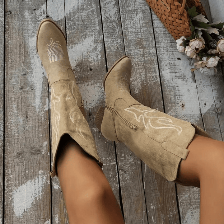 Women's stylish cowboy boots with easy side zipper and pointed toe for versatile fall fashion.