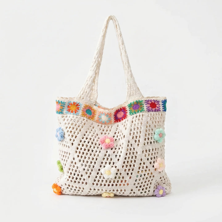 Hand-crocheted women's flower tote bag, chic bohemian accessory for beach, travel, or summer.