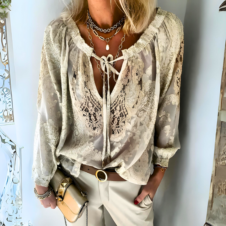 Women's stylish crocheted boho blouse, loose fit, perfect for summer or beach wear. Bohemian chic long sleeve top.
