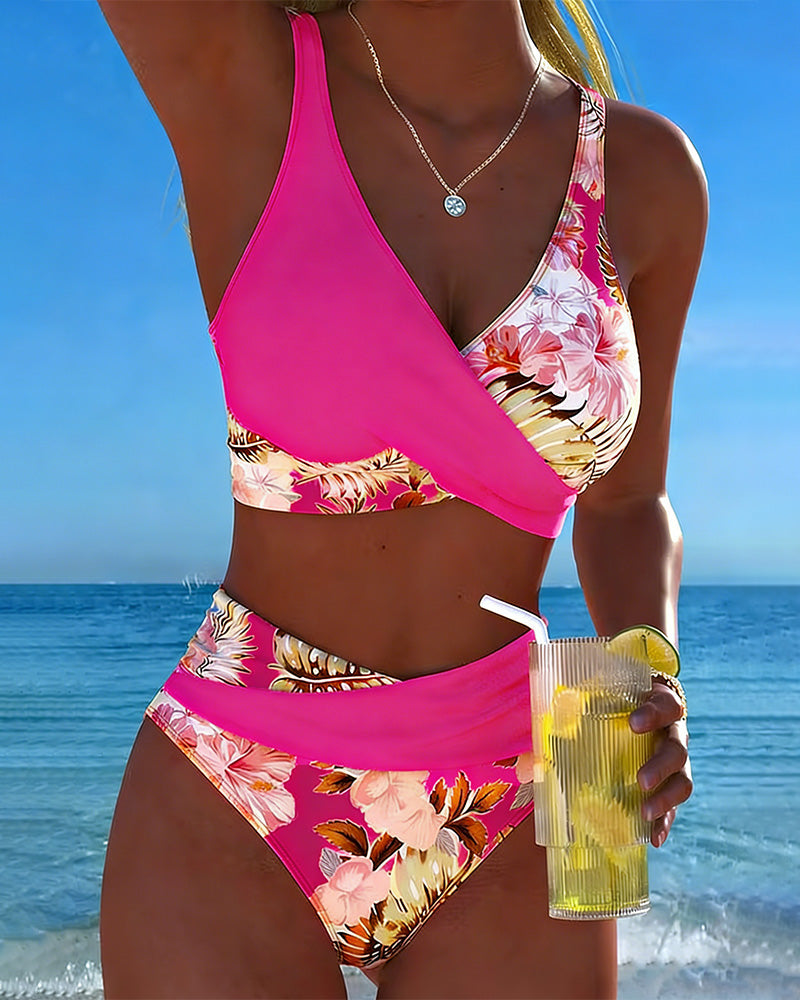Women's vibrant floral two-piece bikini set, fashionable swimwear for summer vacation.