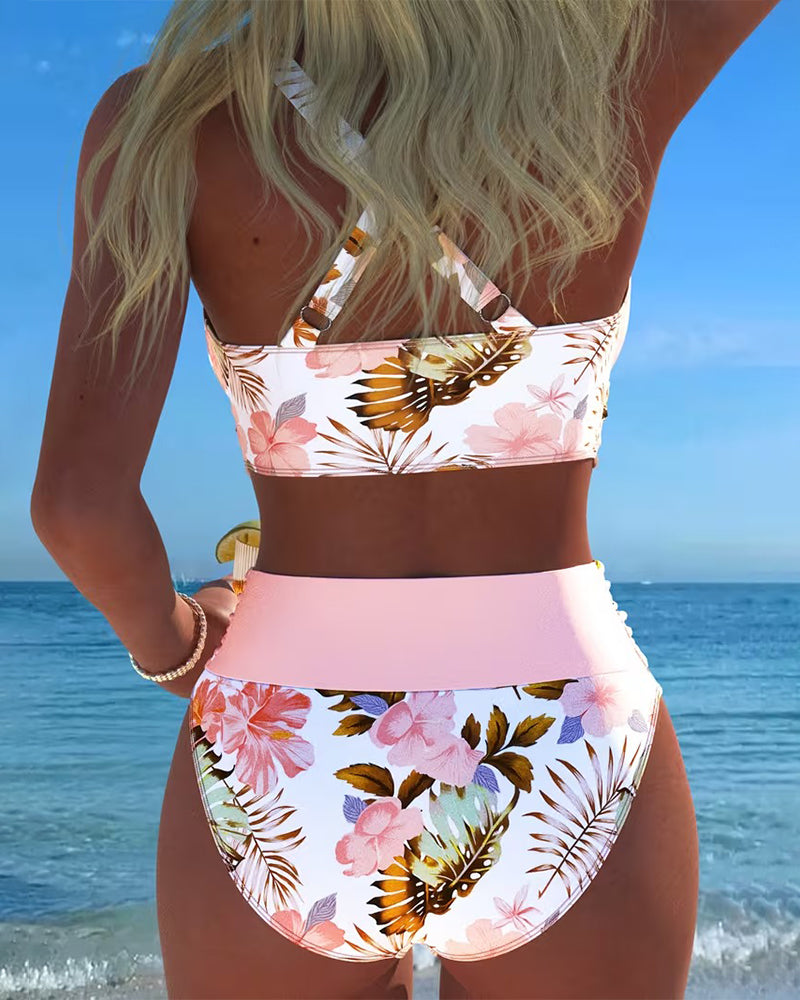 Two-piece women's swimwear with vibrant floral print, ideal for a stylish beach vacation.