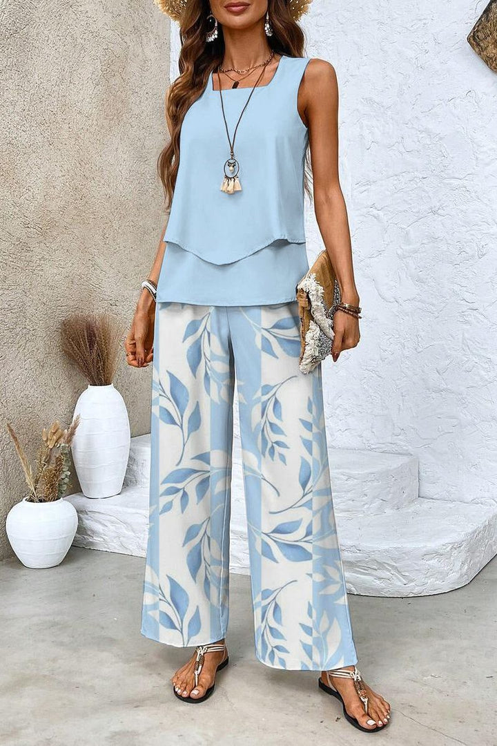 Women's stylish floral print two-piece top & trouser set, perfect for elegant summer or spring wear.