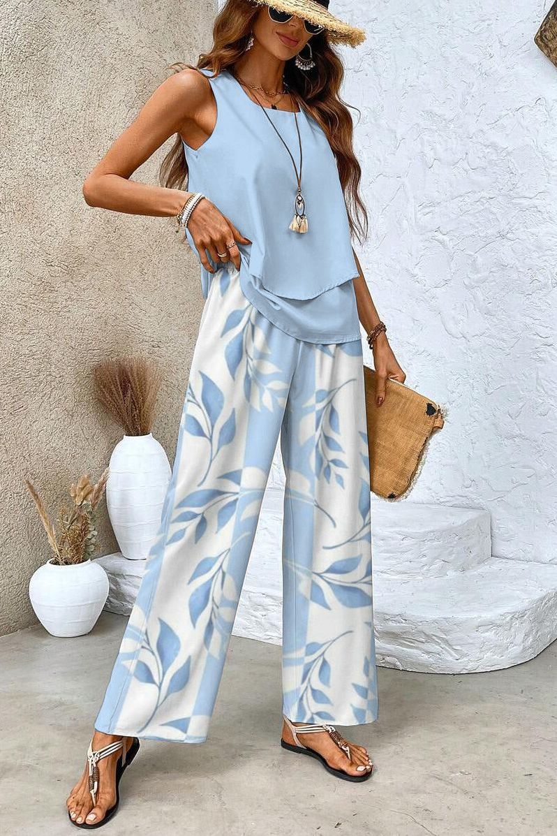 Comfortable women's floral print top & trousers set, ideal for chic casual wear during spring or summer.