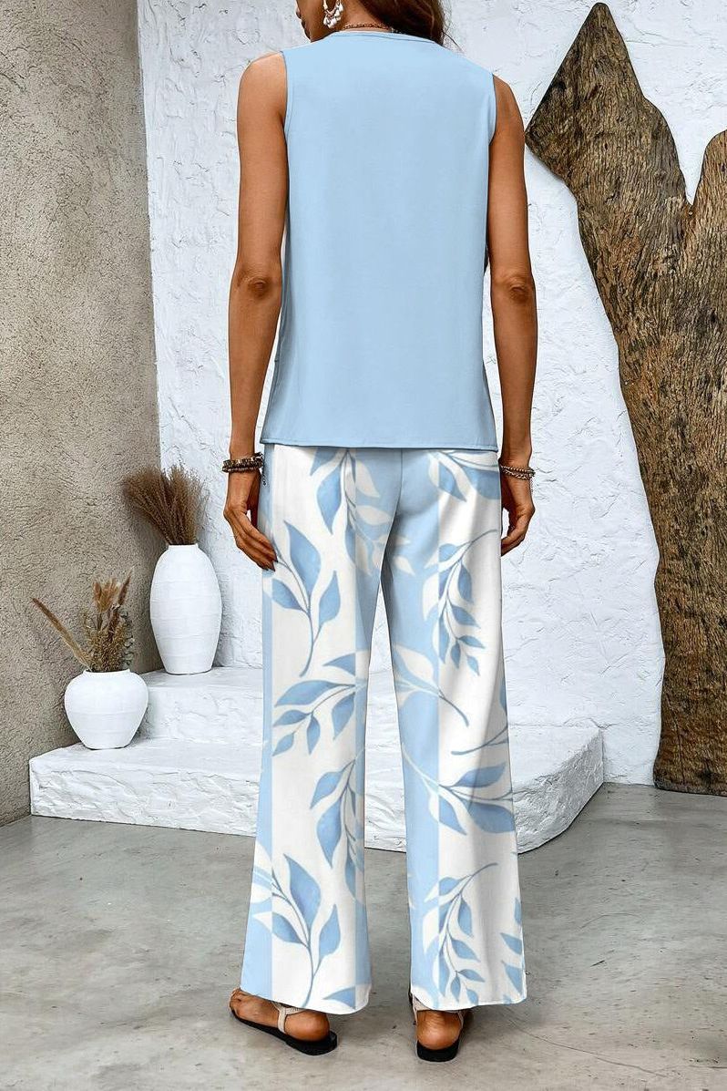 Elegant women's floral matching top & trouser set, a stylish two-piece for a dressy casual spring look.