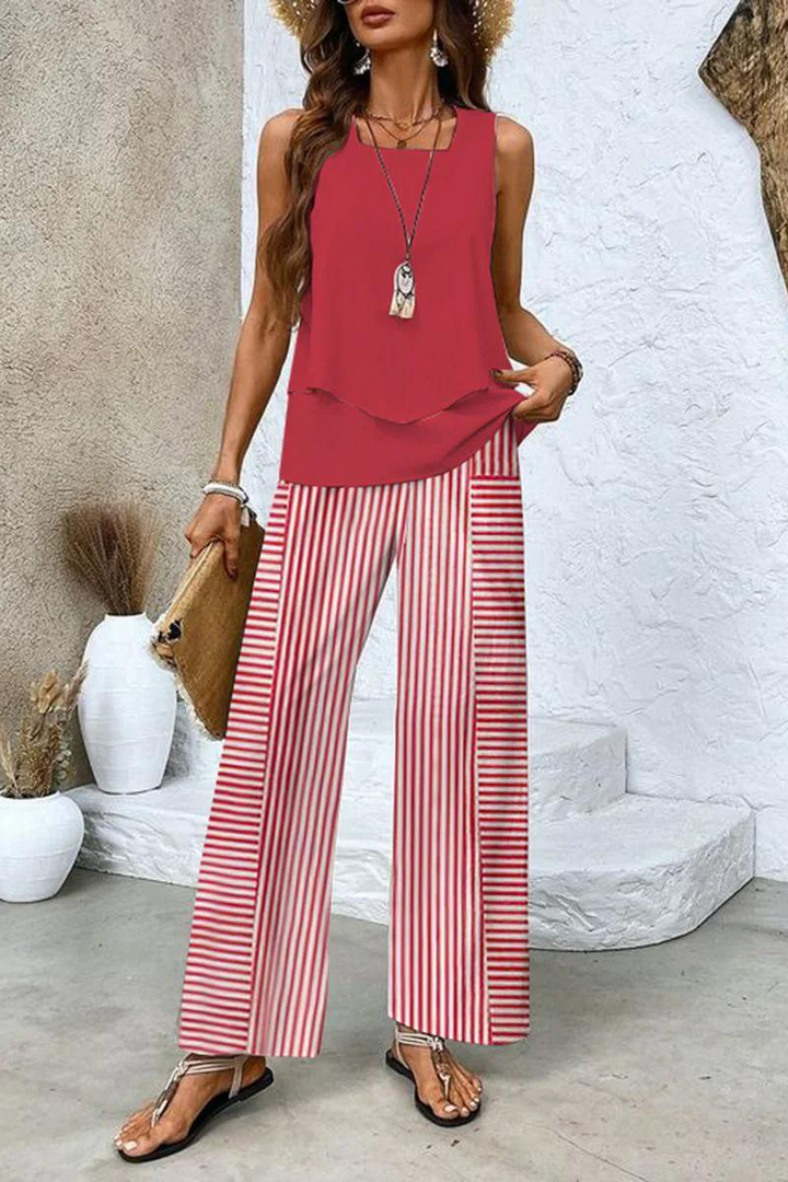 Chic women's floral print top and matching trousers, a stylish two-piece set for spring & summer fashion.