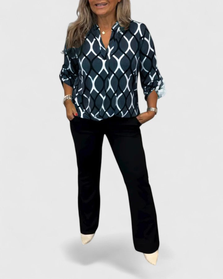 Women's stylish graphic print blouse with three-quarter sleeves, perfect for versatile fashion.