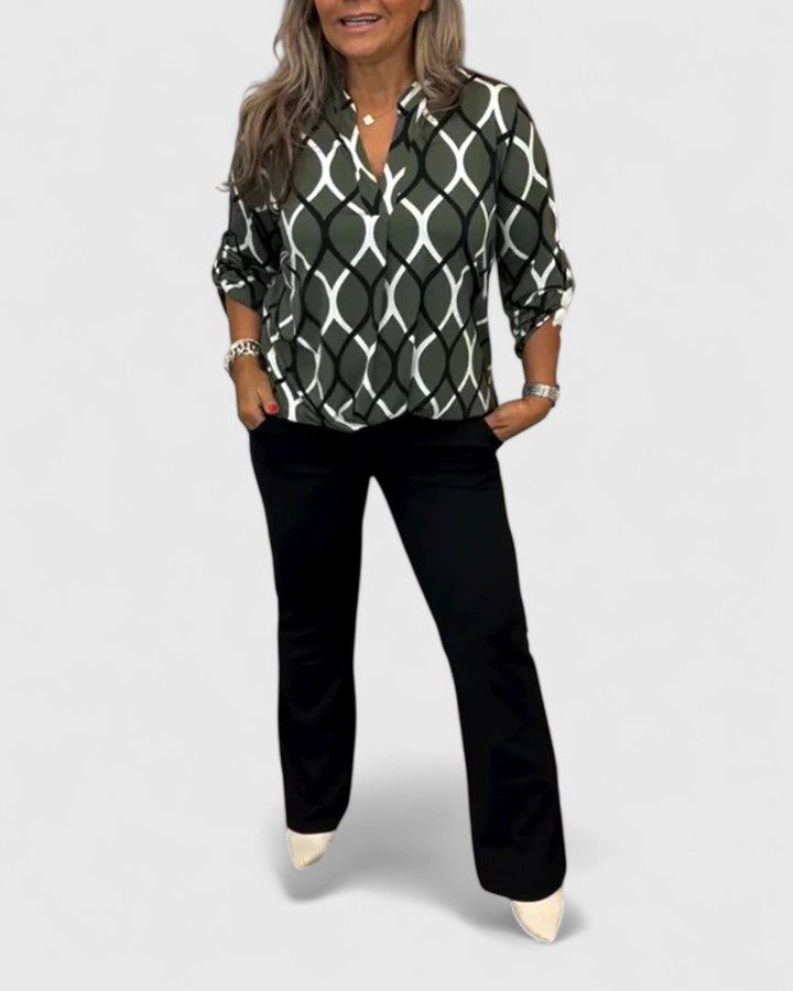 Elegant women's apparel: graphic print blouse with three-quarter sleeves, ideal for stylish daily wear.