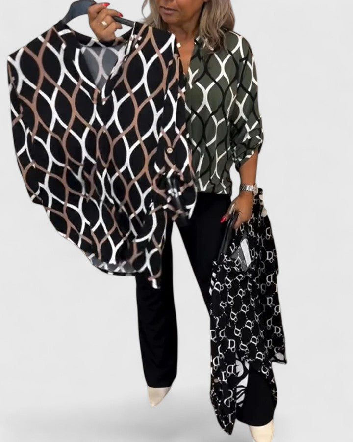 Stylish women's three-quarter sleeve blouse, featuring a unique graphic design for a modern look.