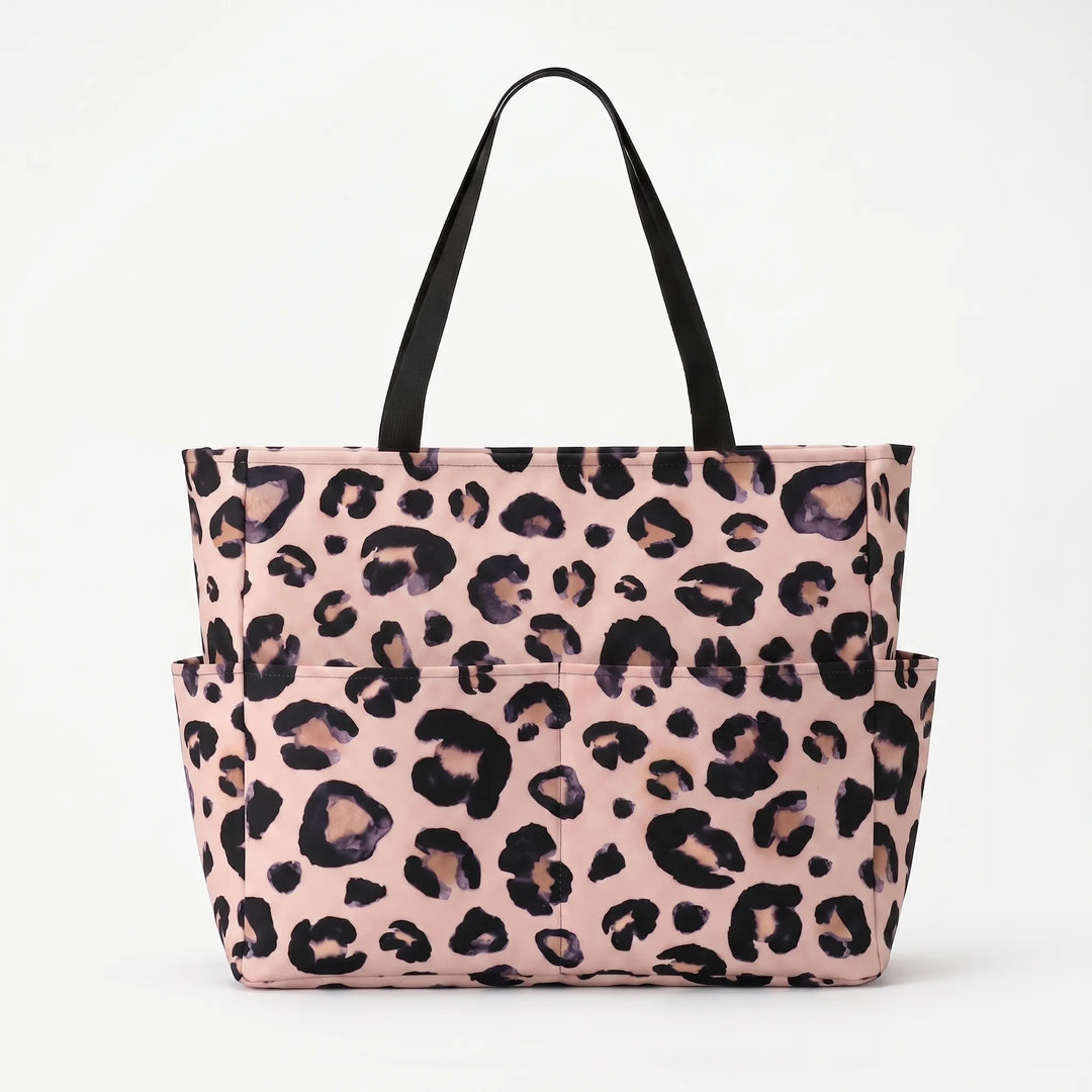 Large women's leopard print tote bag, a stylish and spacious beach or travel shoulder bag for women.