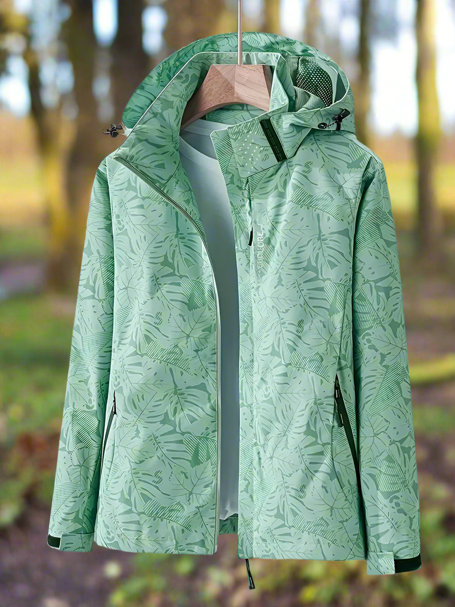 Women's stylish lightweight waterproof jacket in a trendy leaf print. Perfect for summer rain.
