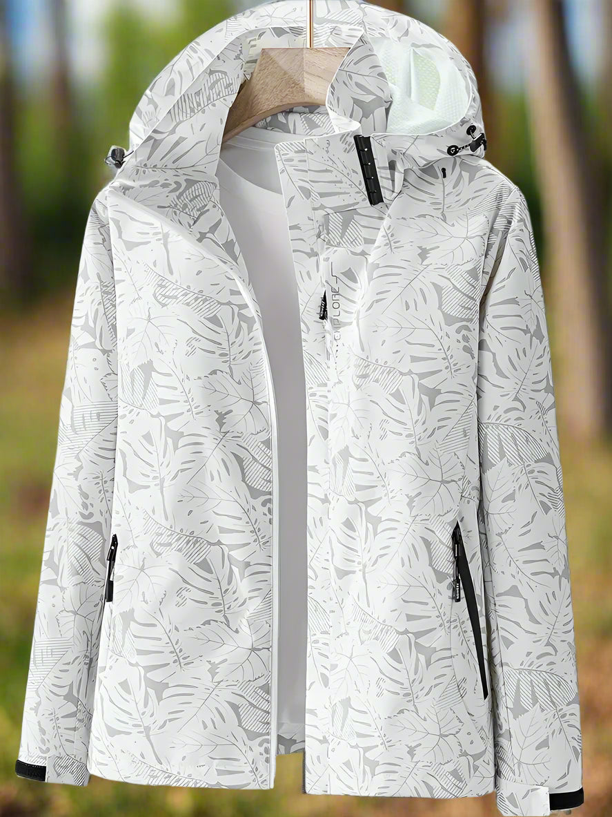Fashionable women's lightweight rain jacket featuring a unique leaf print & waterproof design.
