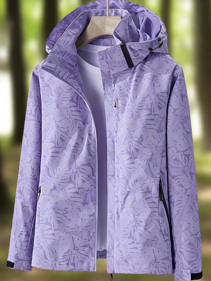 Women's waterproof summer outerwear, a lightweight & breathable jacket with stylish leaf pattern.