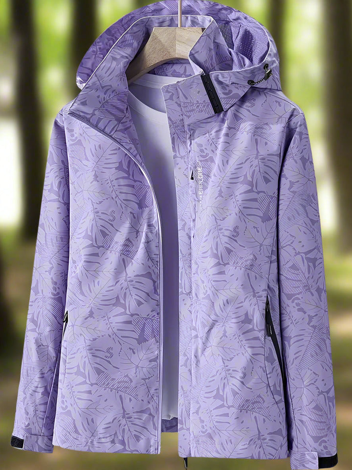 Women's waterproof summer outerwear, a lightweight & breathable jacket with stylish leaf pattern.