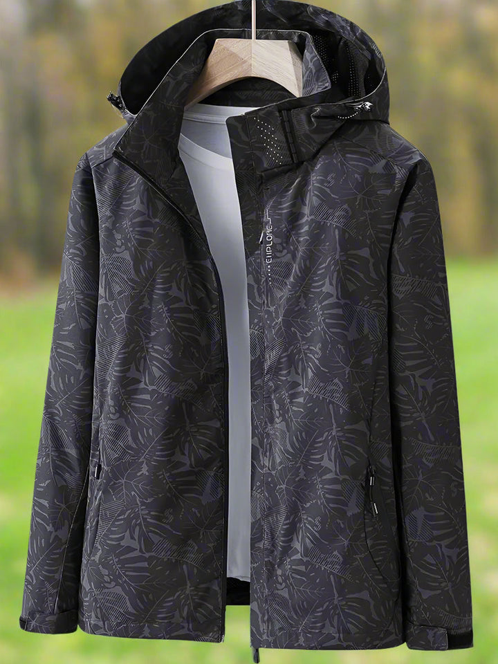 Trendy women's waterproof jacket for rain, lightweight design with a chic leaf print for summer.