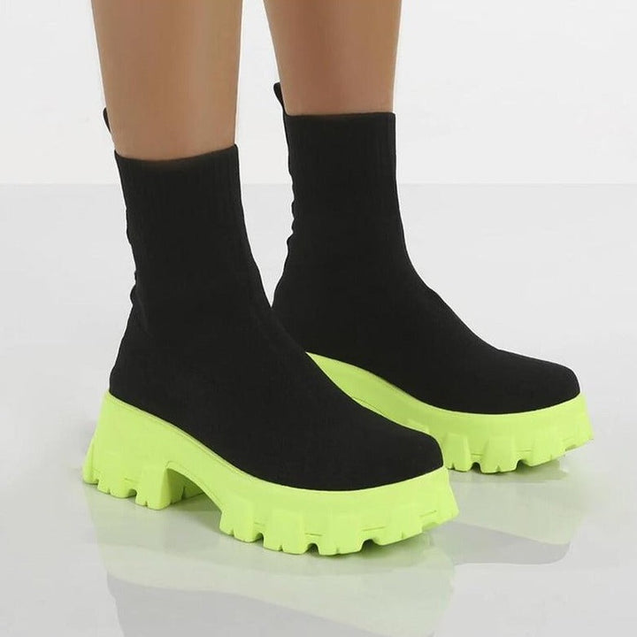 Stylish women's slip-on ankle boots, comfortable and versatile footwear for casual fashion.