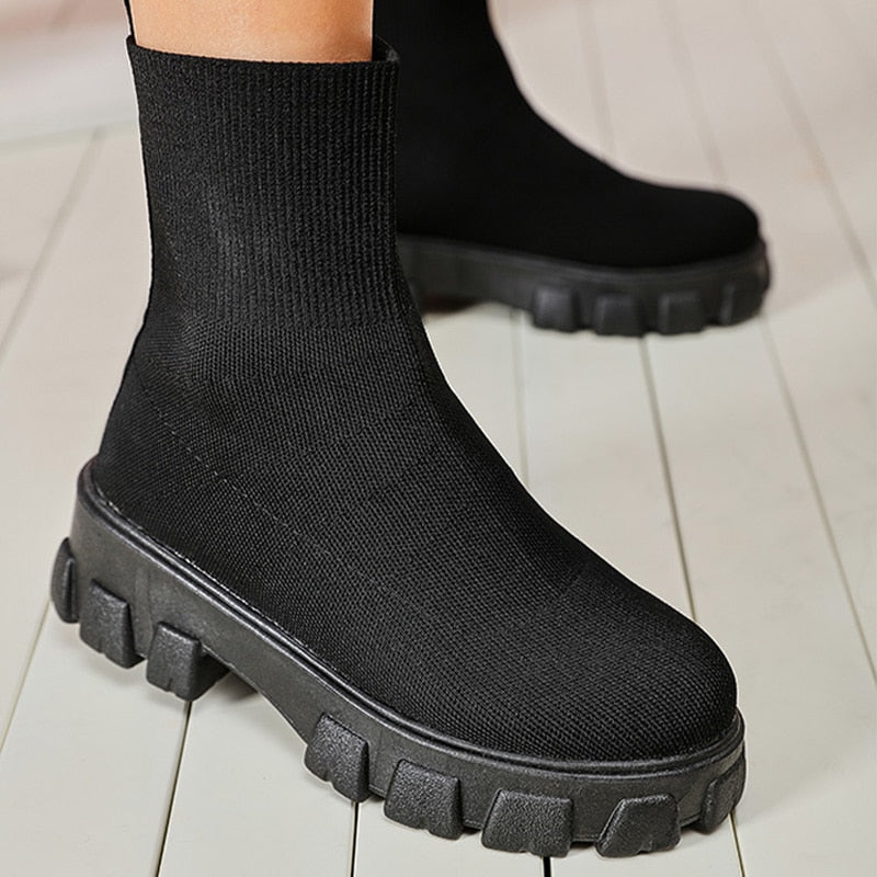 Sleek women's slip-on ankle boots, stylish and comfortable footwear for versatile everyday fashion.