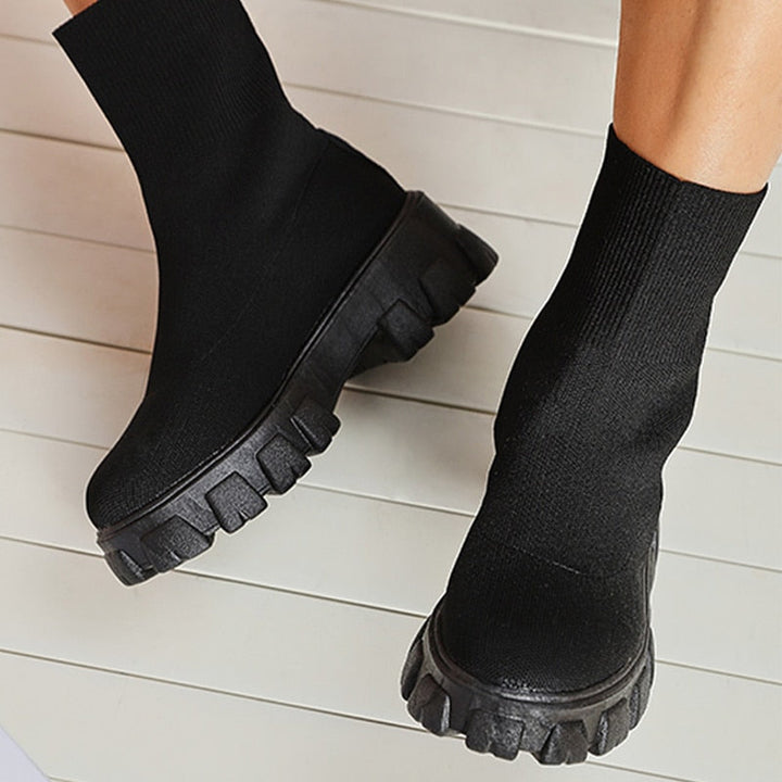 Close-up of women's slip-on ankle boot, showcasing stylish design and comfortable everyday wear.
