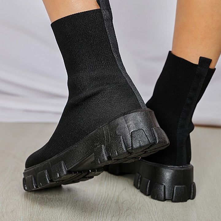 Women's stylish slip-on ankle boots, versatile footwear for casual everyday fashion outfits.