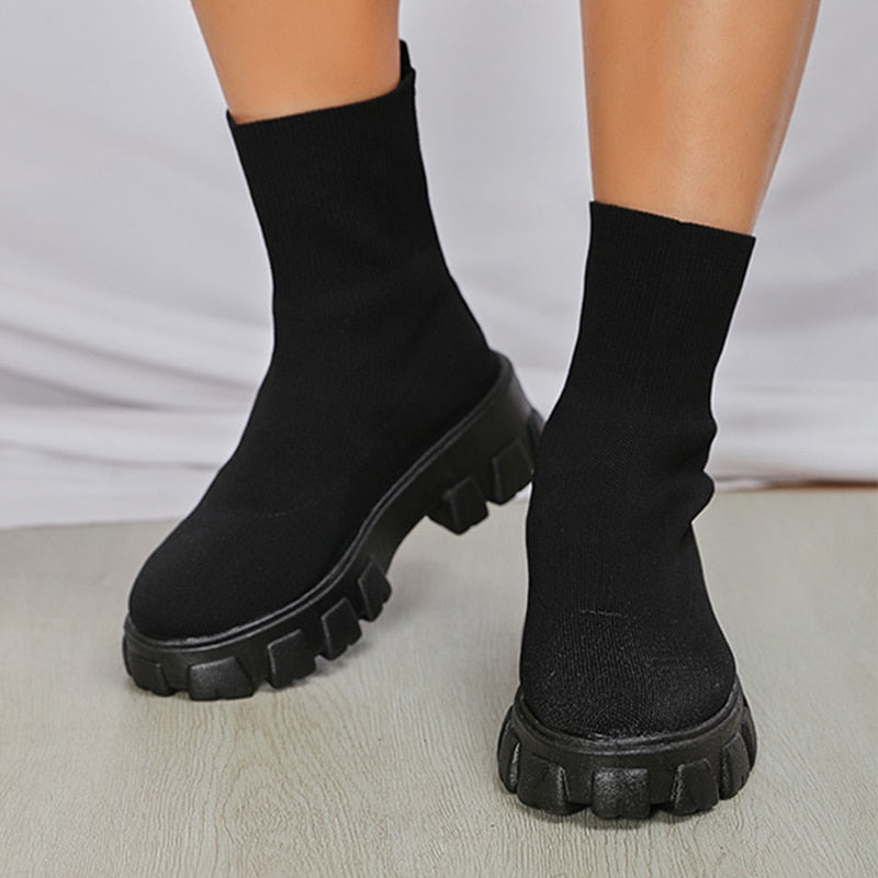 Chic black women's slip-on ankle boots, comfortable and stylish for versatile everyday fashion.