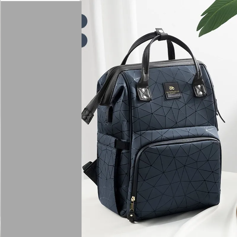 Mommy bag with anti-theft back pocket for valuables, waterproof design.