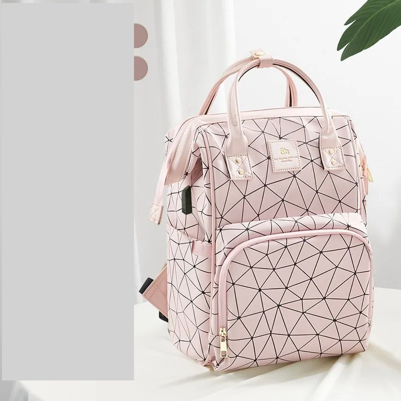 Pink stylish waterproof diaper backpack, a chic and practical baby bag.