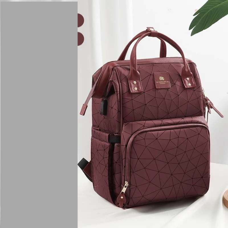 Group of women's waterproof diaper backpacks in different colors, large capacity.