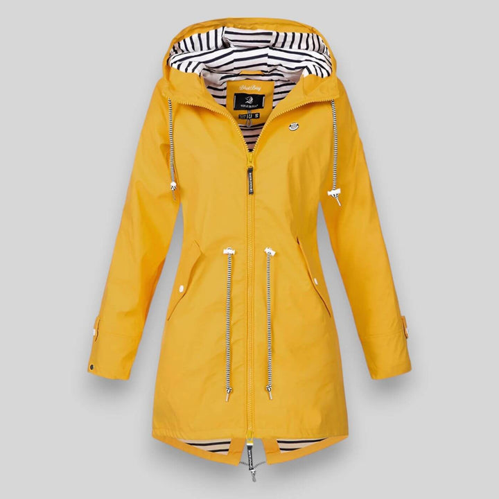 Stylish women's waterproof rain jacket, perfect for outdoor adventures and casual everyday comfort.