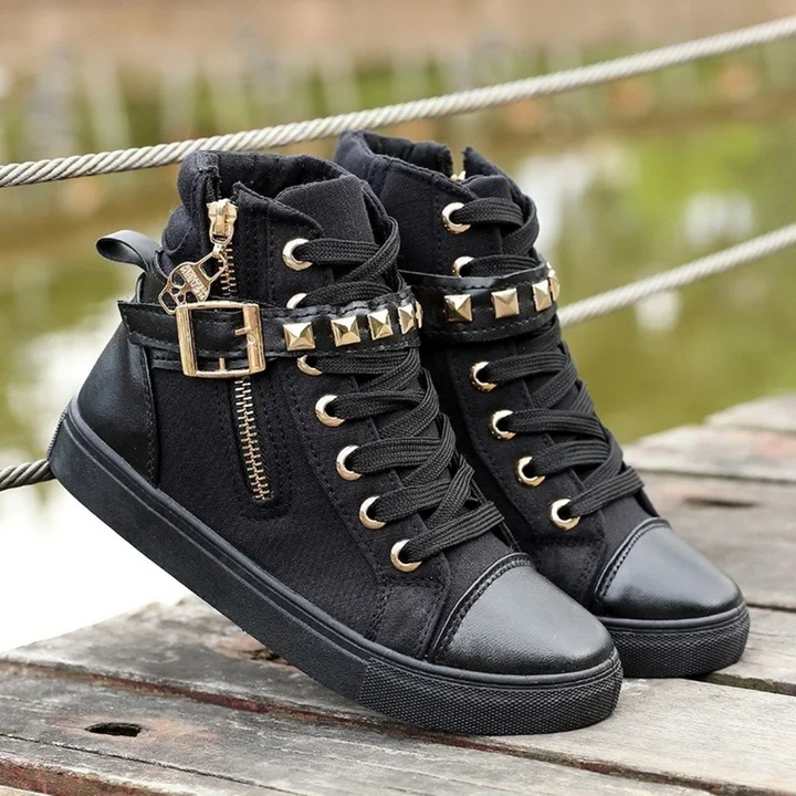 Comfortable white high-top women's trainers featuring a convenient side zipper for easy on/off and modern style.