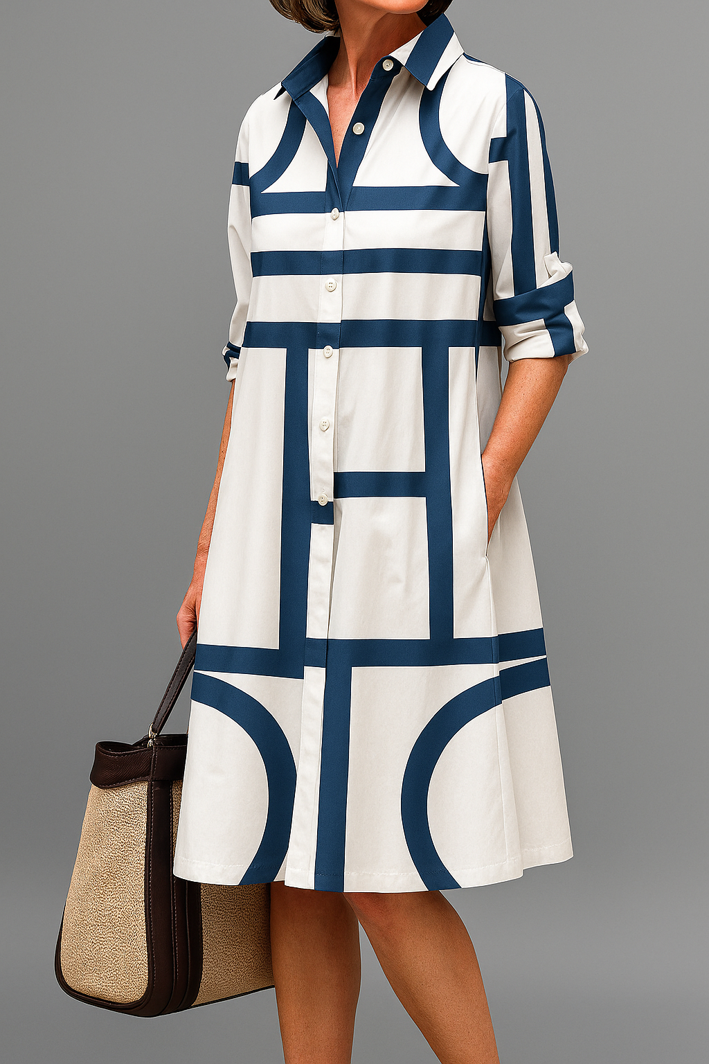Women's stylish white shirt dress for casual everyday wear, featuring a geometric print and collared knee-length design.