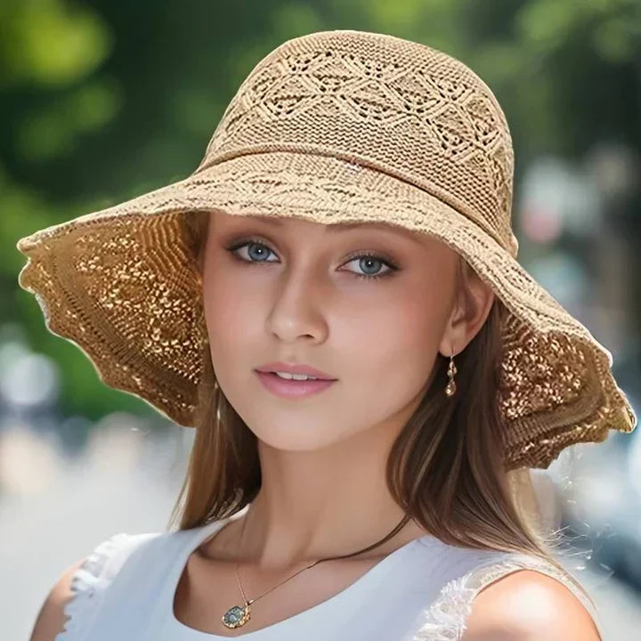 Beach-ready wide brim sun hat for women, with a chic lace pattern; comfortable and travel-friendly.