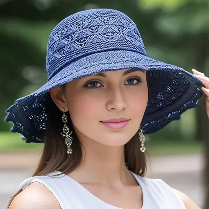 Stylish women's sun hat, wide brim with a lovely lace design. Perfect for sunny days & vacation.