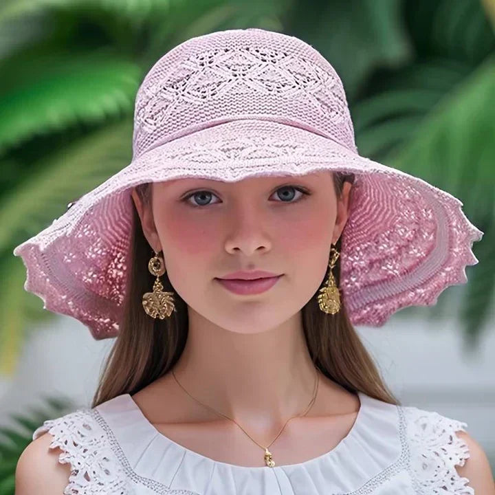 Fashionable wide brim sun hat for women, featuring a unique lace pattern; ideal for summer adventures.