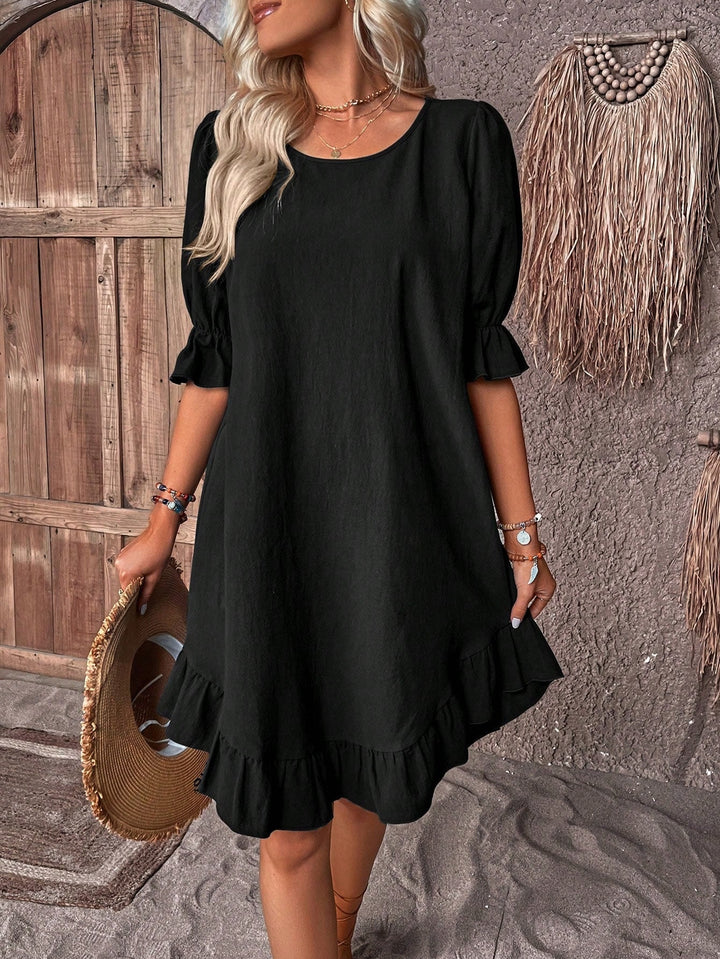 Plus size women's midi dress with a relaxed, flowy fit & effective tummy control. Comfortable for summer wear.