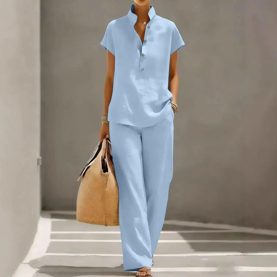 Relaxed fit women's two-piece summer outfit featuring a comfortable short sleeve top and wide-leg trousers.