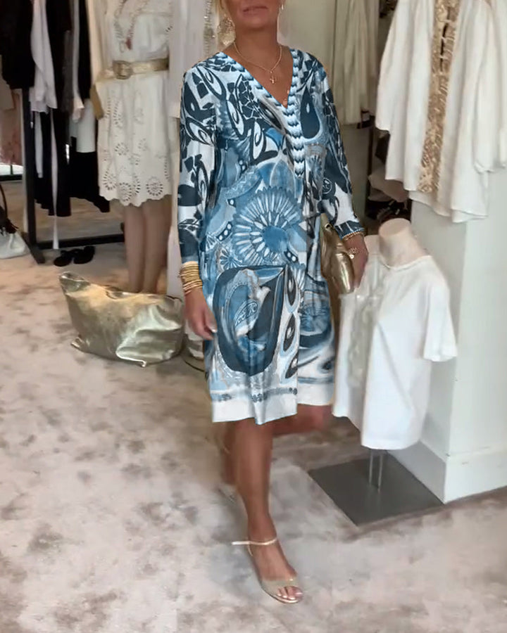 Resort wear Sunburst Boho Tunic Dress, a women's printed v-neck for summer comfort & style.