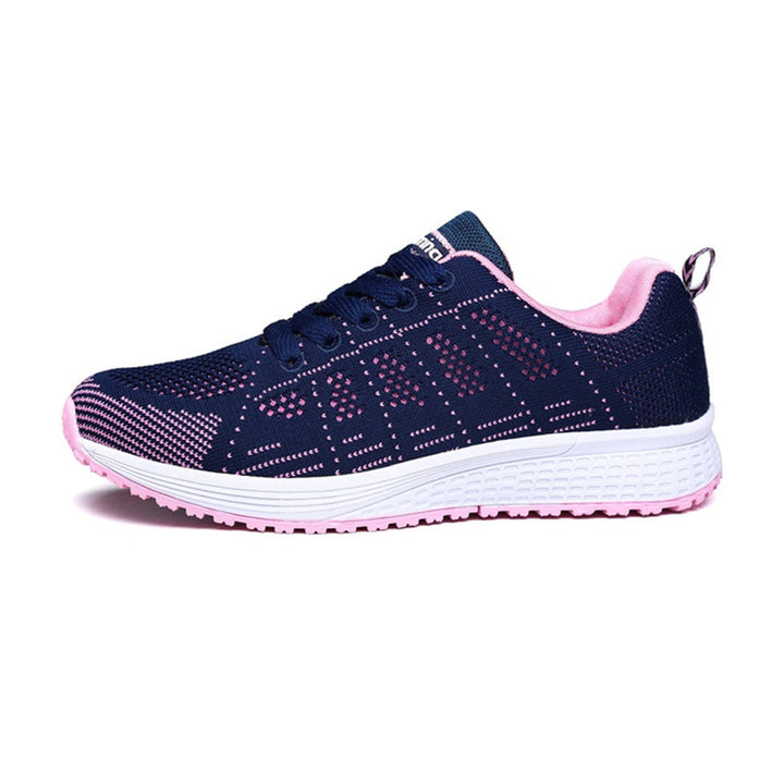 Front view of women's comfort walking sneakers. Features adjustable straps, ergonomic arch support, and cushioning.