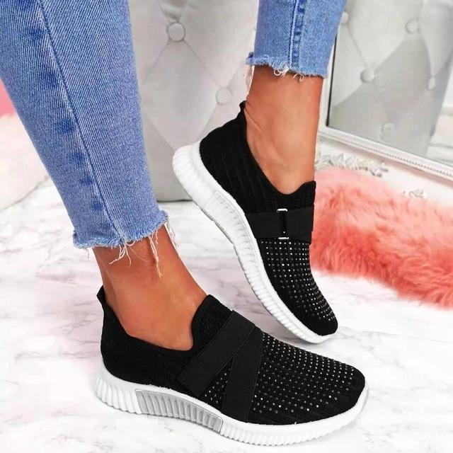 Front view of women's supportive slip-on sneakers, showcasing adjustable fit and comfort features.