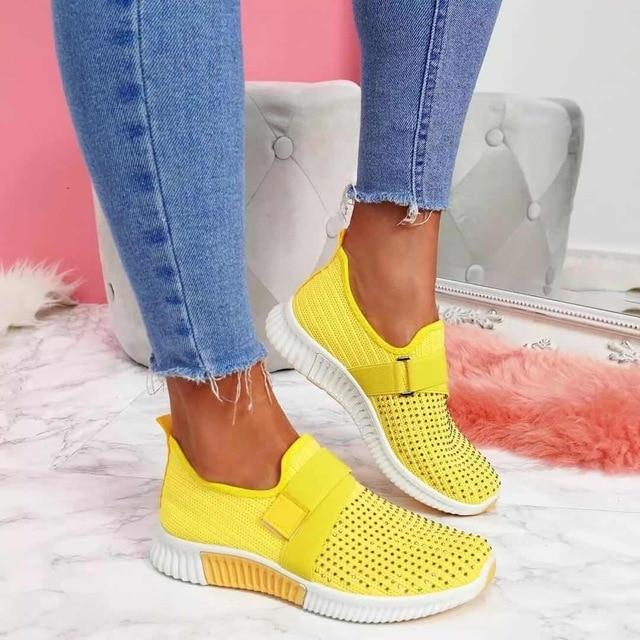 Side view of comfortable women's slip-on sneakers, featuring posture support for walking & daily use.