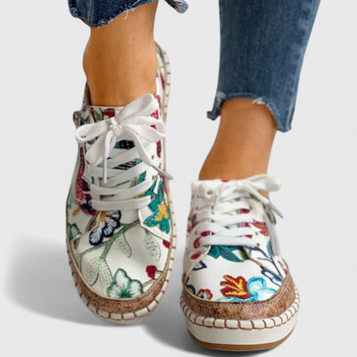 Orthopedic women's slip-on walking shoes offering arch support & comfort for casual or everyday wear.