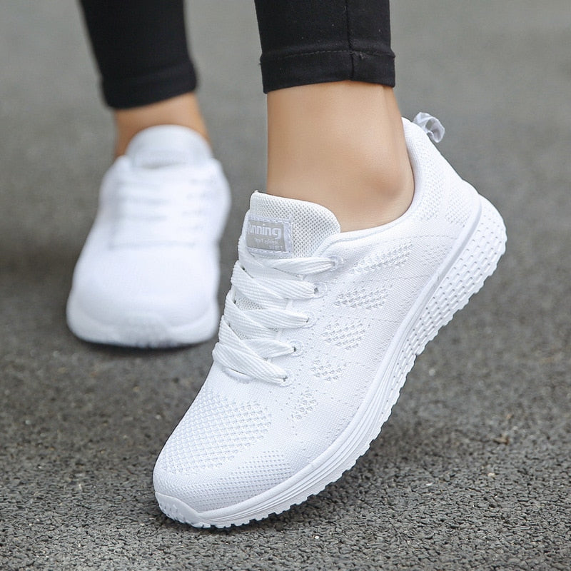 Women's supportive walking shoes in a vibrant color, designed for comfort & posture correction.